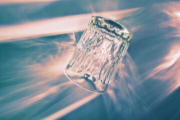 Closeup shot of glass turned upside down in blue background