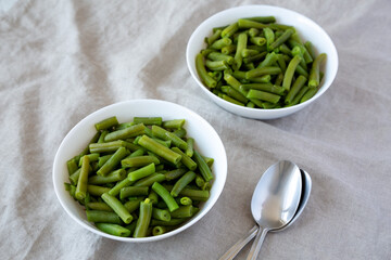 Steamed Green Beans in a White Bowl, low angle view.