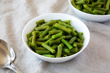 Steamed Green Beans in a White Bowl, side view.