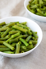 Steamed Green Beans in a White Bowl, low angle view.
