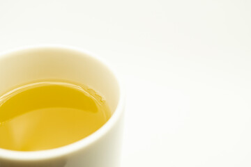 Green tea on a white background. Image of Japanese green tea. Cup of tea isolated on white background