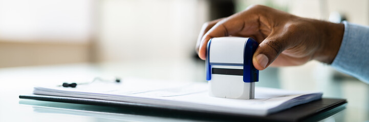 Public Notary Putting Company Stamp On Contract