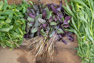 Fresh bio vegetables and herbs at the morning street farmer market. Local weekend agricultural...