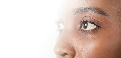 Close up, profle photo of a dark skin female eye, iris, pupil, eye lashes, eye lids. - 503079574