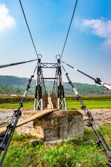isolated iron suspension bridge old with blue sky background at morning