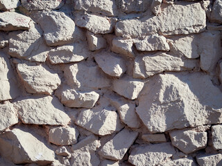 Rough stone wall. Texture of masonry.