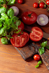 Tomatoes with basil and red onion.