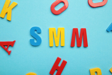 SMM, social media marketing symbol. Concept word SMM social media marketing on blue background. Business, SMM social media marketing concept.