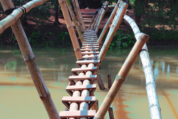 Fototapeta premium Bamboo bridge for crossing river pond in Bangladesh