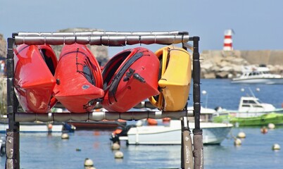 Fototapeta na wymiar Colorful canoes by the sea