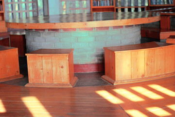 Concrete table with creative wood seat in a library at Zinda Park, Bangladesh. Interior decoration of a library.