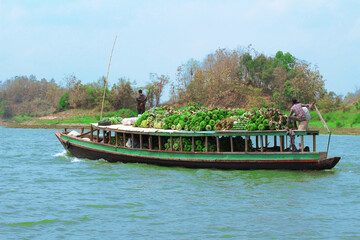 Boat loaded with fruits and vegetables. Deliver them to the vegetable traders all over the country.