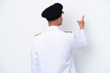 Airplane caucasian pilot isolated on white background pointing back with the index finger