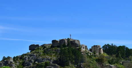 Mountain top view of a religious cross in France