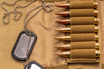 Army identification medallions, bandolier with cartridges, Concept: military special operation,...
