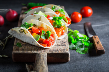 Tasty and vegetarian tacos as spicy Mexican snack.