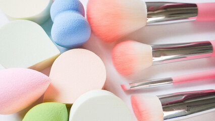 Obraz na płótnie Canvas Professional makeup applicators and tools, sponges and brushes on white background