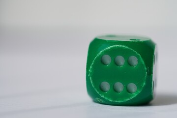 green dice with six number