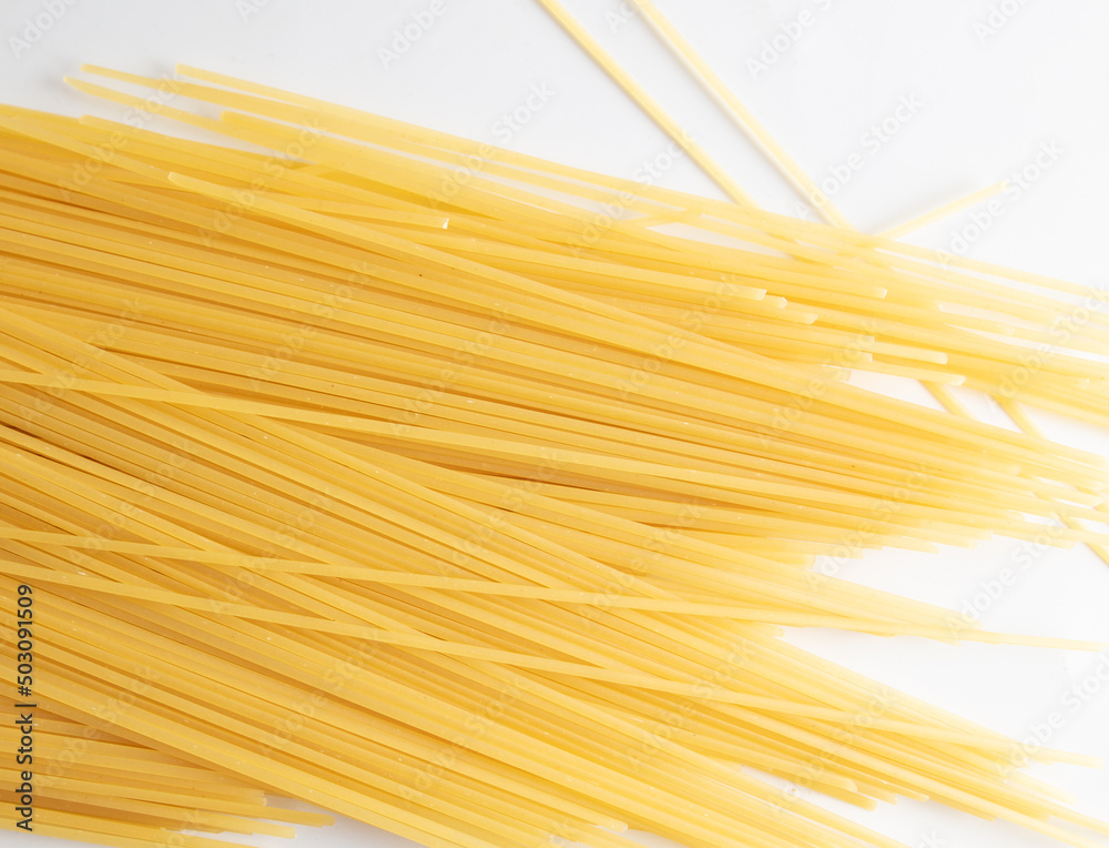 Sticker Dried long pasta isolated on white background.