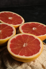 sliced ripe grapefruit on a light cloth