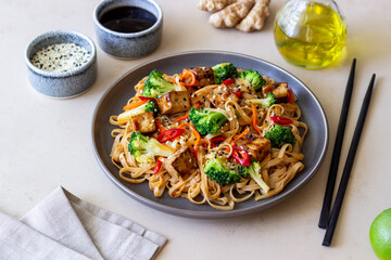Udon noodles with tofu, broccoli, carrots, pepper and sesame. Healthy eating. Vegetarian food. Asian food.