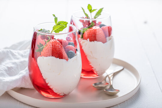 Creamy and delicious jelly served in elegant glass with fruits.