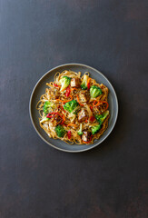 Udon noodles with tofu, broccoli, carrots, pepper and sesame. Healthy eating. Vegetarian food. Asian food.