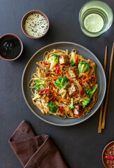 Udon noodles with tofu, broccoli, carrots, pepper and sesame. Healthy eating. Vegetarian food. Asian food.
