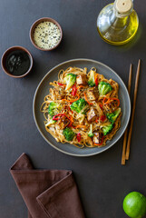 Udon noodles with tofu, broccoli, carrots, pepper and sesame. Healthy eating. Vegetarian food. Asian food.