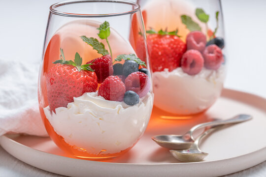 Fresh and sweet jelly with berries and whipped cream.