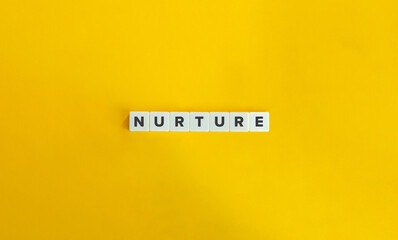 Nurture Word on Letter Tiles on Yellow Background. Minimal Aesthetics.