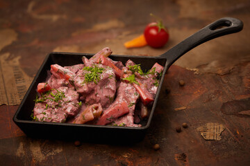 Rabbit meat with seasonings and greens