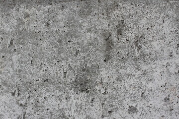 Rough gray surface of dry concrete wall close-up of industrial texture for background.