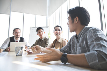Business people discussing together in conference.