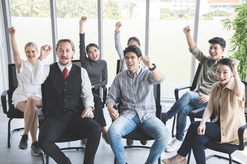 Team of business people doing happy gestures.