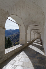 Fototapeta na wymiar Ancient arcades passageway, St Magnus sanctuary, Castelmagno, Italy