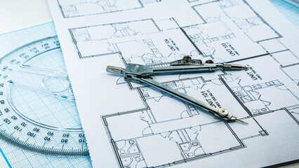 Office blue print with drawing compass and ruler