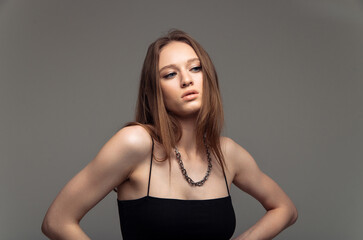 Fototapeta premium Need to think. Serious young woman while being deep in thoughts about her problems and family quarrels
