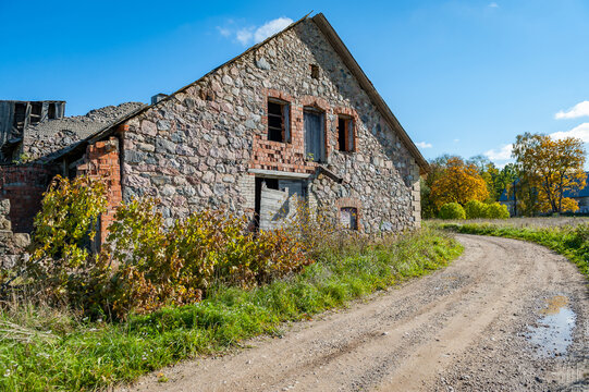 An old neglected barn. Dilapidated farmhouse on a long abandoned farm.
