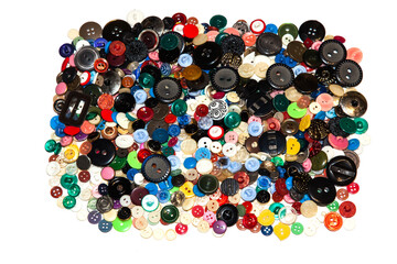 Multi-colored buttons on a white background close-up.