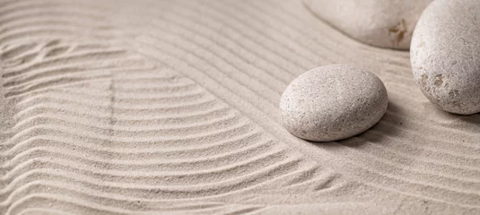Fotobehang Zen Stenen Round stones on the sand, zen, relaxation, texture, background, place for text  © mira_y