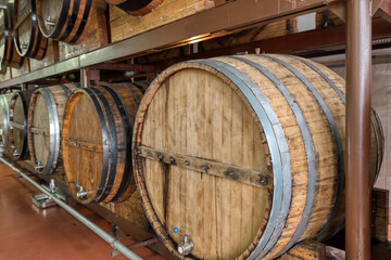 Wooden cask to make luxury alcohol drinks stand in cellar