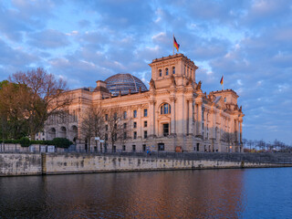 Rear of the Reichstag building in Berlin as seen from across the river Spree housing the German parliament.