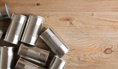 recycled cans, reused on a table with a brown background