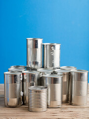 recycling of cans for home on rustic wooden table. second life to aluminum cans