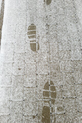 Footprints in fresh snow background great concept for winter footwear