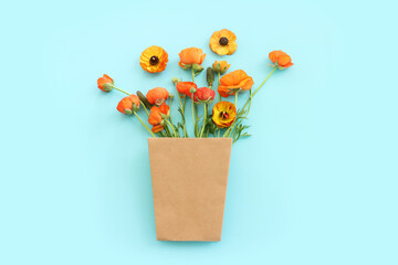 Top view image of yellow flowers composition over blue background