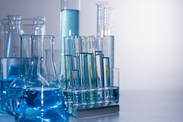 Close up of labware such as beaker, flask, graduated cylinders and test tubes well placed