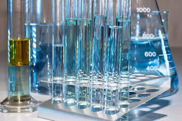 Close up of labware such as beaker, flask, graduated cylinders and test tubes well placed