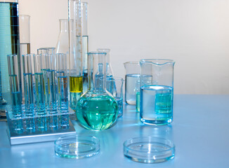 Close up of labware such as beaker, flask, graduated cylinders and test tubes well placed